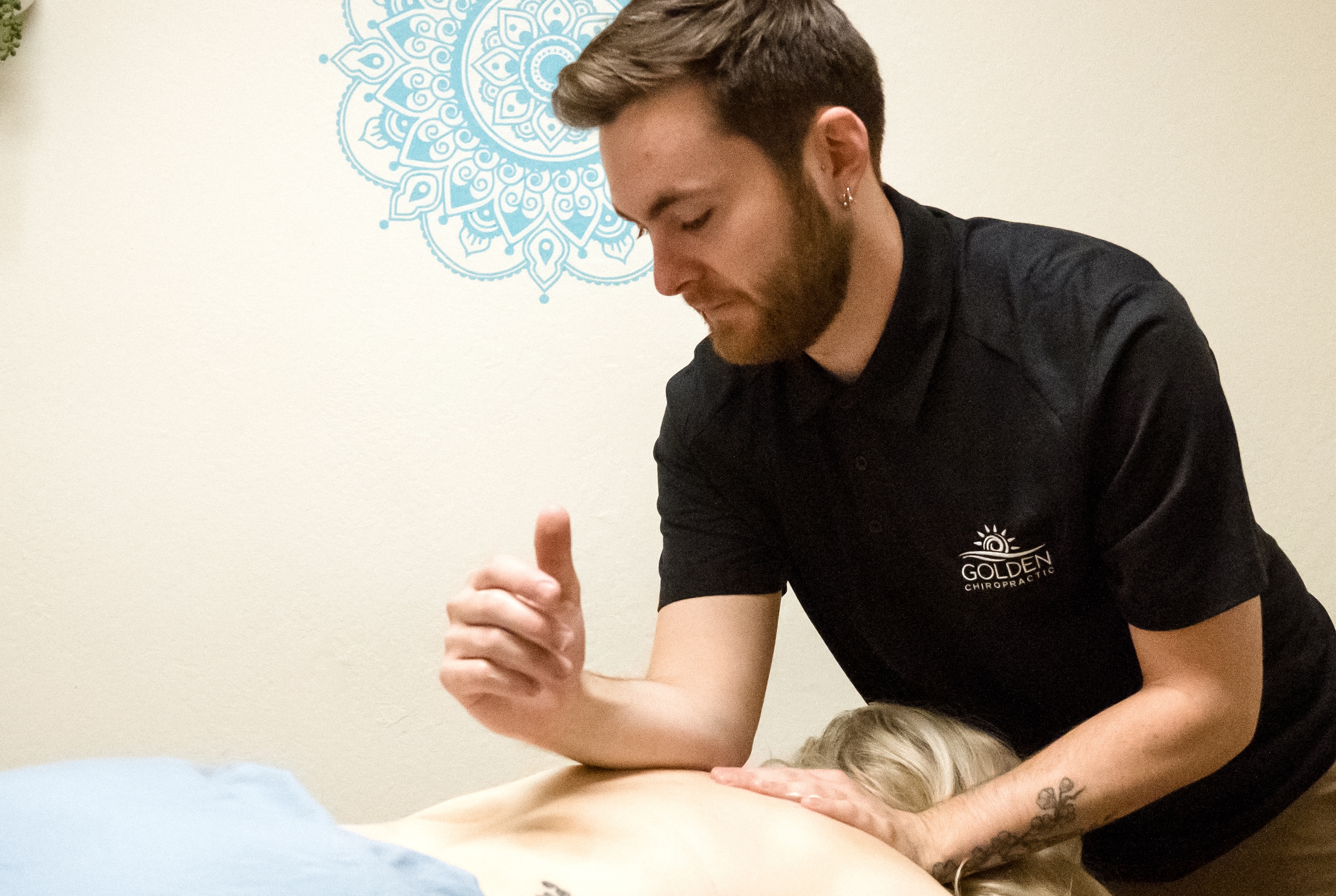 Kyle massaging a female patient