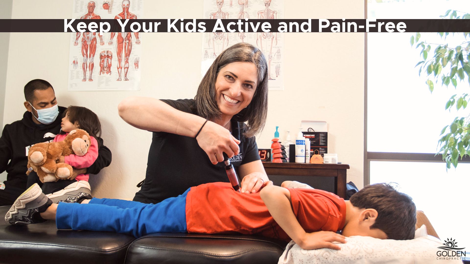 Dr. Goldi using the activator on a school-age child